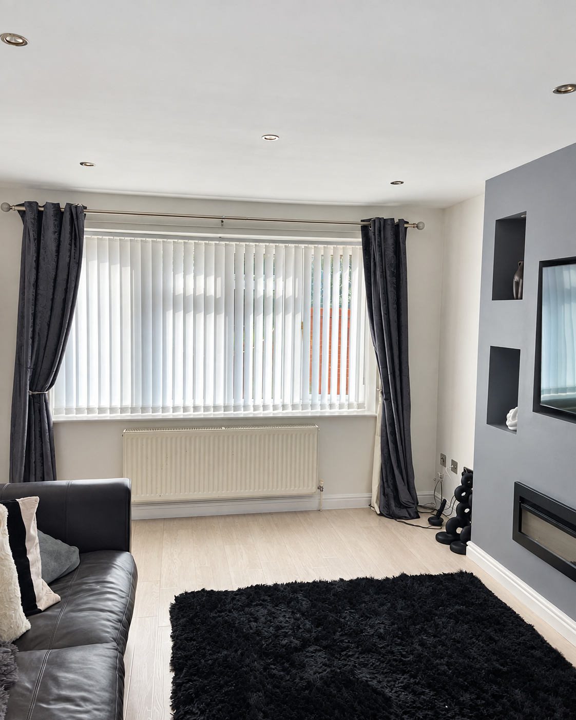 White vertical blinds fitted in a modern Bradford living room