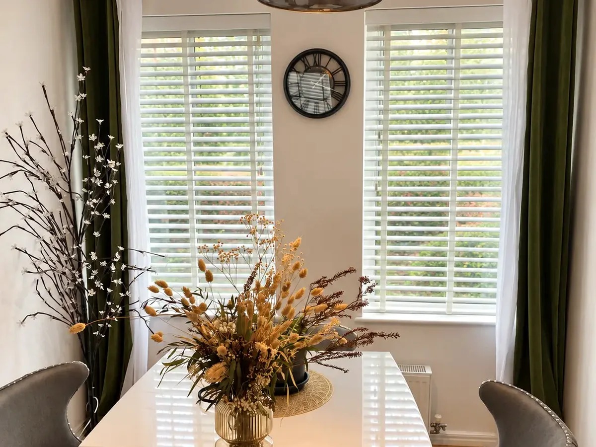 White wooden Venetian blinds fitted in a Bradford dining room